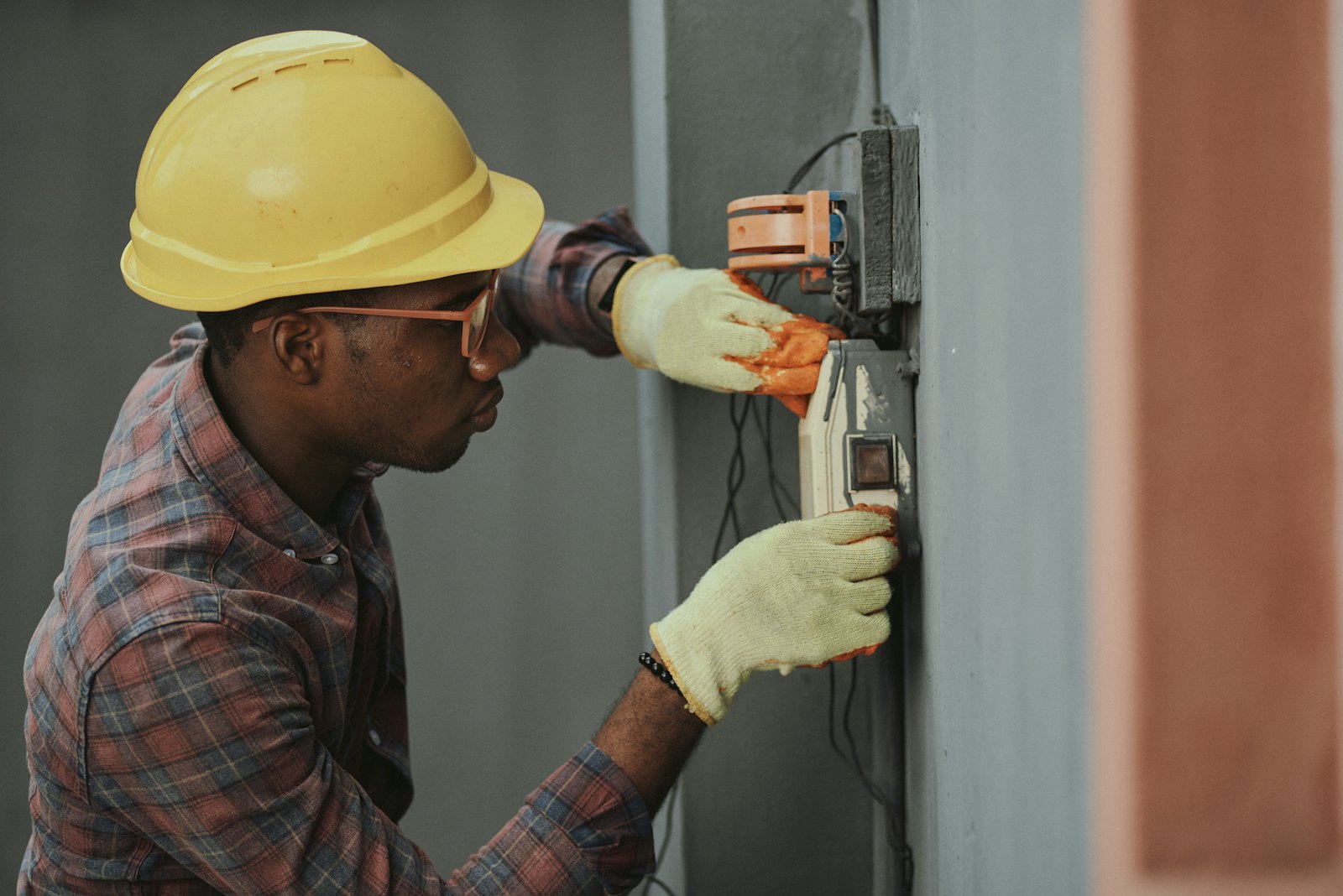 An electrician working on site